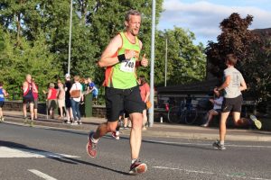 Running Gait Analysis. Man running at a marathon. 